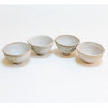 Set of 4 brutal white tea bowls with a quail egg spot