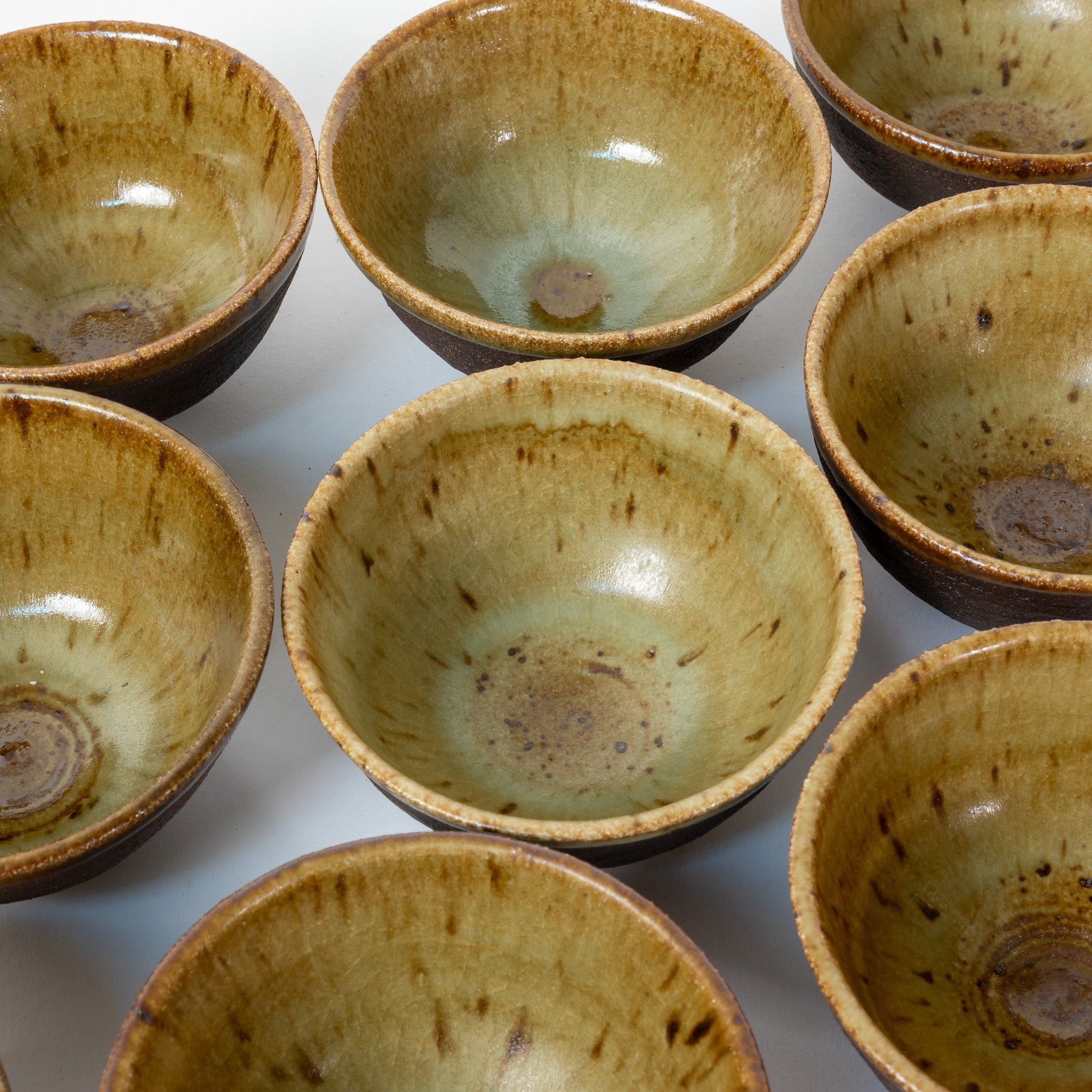 Unique set of 9 black exterior, golden olive interior.